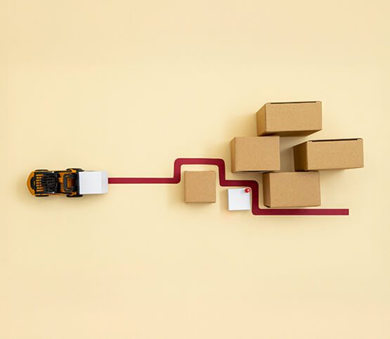 Two professionals having a focused discussion in an office setting, reviewing documents, symbolizing business consulting, strategic planning, and collaborative problem-solving.