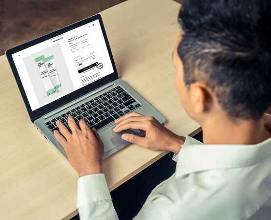 A professional person working on a laptop, with a close-up of their hands on the keyboard, illustrating the efficient and modern e-commerce platform and user interaction.