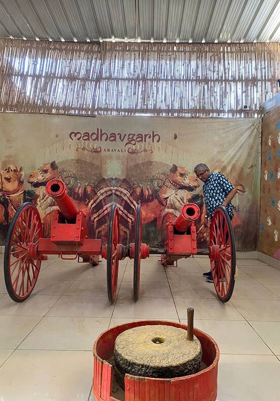 Wisitech team outing photo featuring a colorful cultural display with a cart, reflecting the company's vibrant life outside of work.
