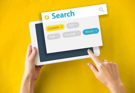 Wisitech portfolio: Visual representing SEO (Search Engine Optimization) strategy, showing a hand searching on a tablet for Digital Marketing results.